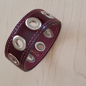 Coach 1 inch Burgundy patent Leather bracelet with silver grommets